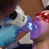 Figure 9. Velscope® being used for an oral cancer screening Copyright © Image courtesy of LED Dental Inc.